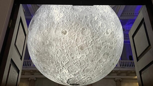 A grand hallway with an ornate ceiling and a large spherical moon-like structure suspended from the ceiling. - Charming Wentworth Lodge With Countryside Views (Rotherham)