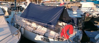 Stay on a charming sailboat at the quayside.