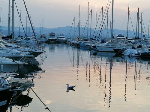 Stay on a charming sailboat at the quayside.