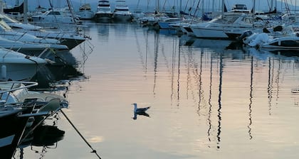 Stay on a charming sailboat at the quayside.