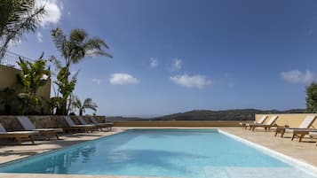 Seasonal outdoor pool, pool umbrellas, pool loungers