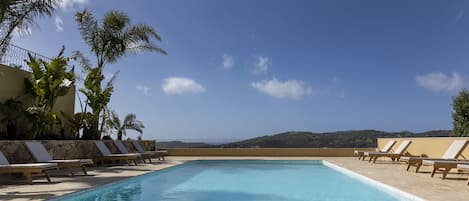 Seasonal outdoor pool, pool umbrellas, pool loungers
