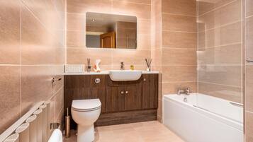 Bathtub, hair dryer, towels