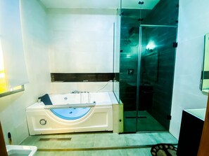 Combined shower/tub, jetted tub