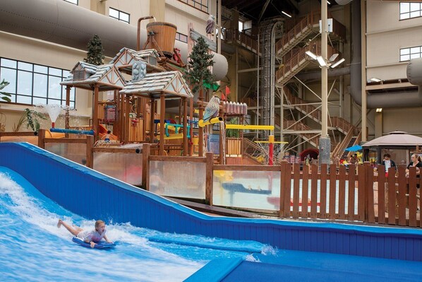 Experience the thrill of our indoor water park with a wave pool and play structures for all ages.