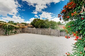 Surrounded by traditional buildings, this outdoor space offers a peaceful retreat.