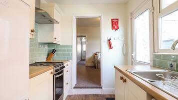 Fridge, electric kettle, toaster, cookware/dishes/utensils