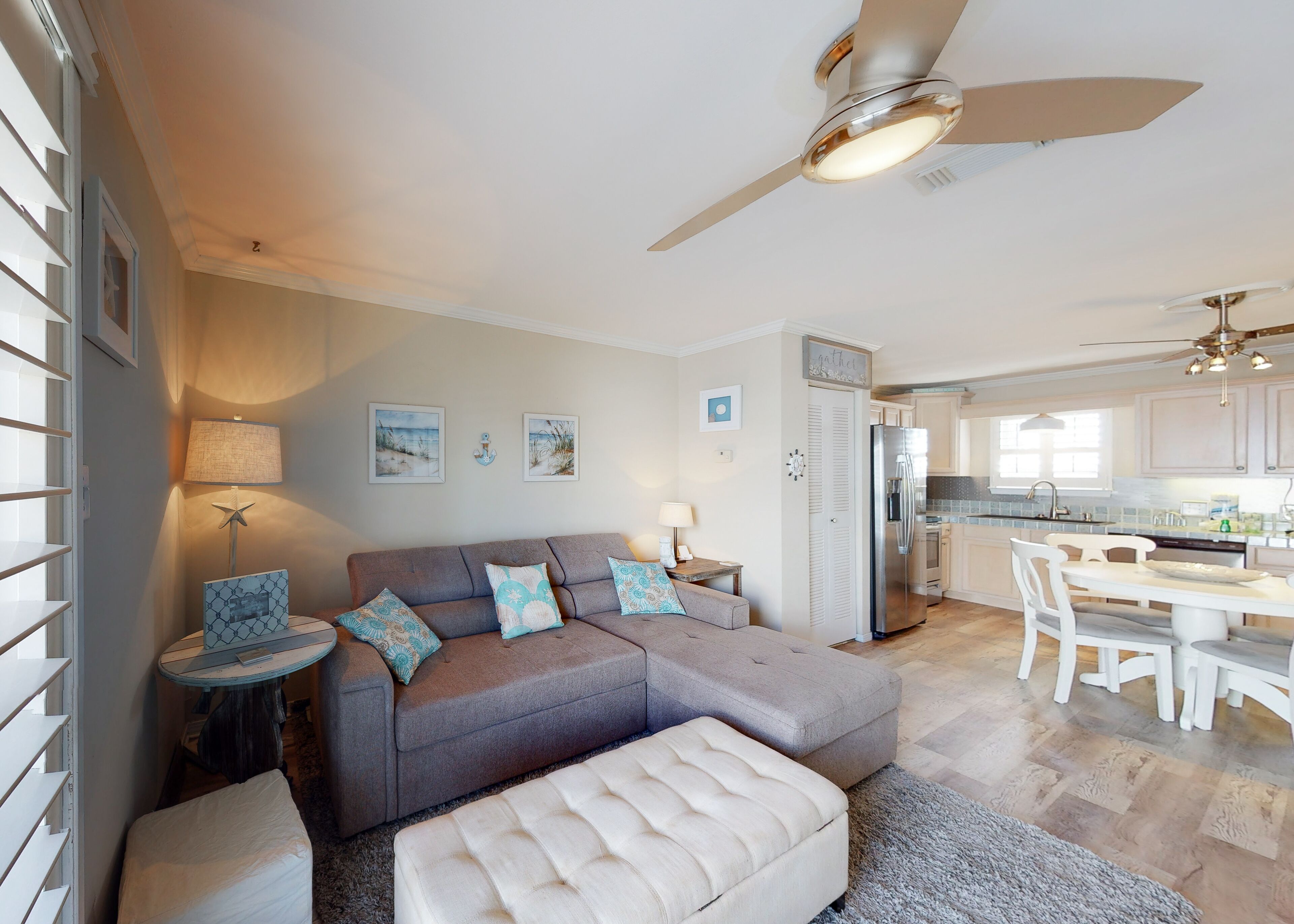 Cozy coastal condo close to beach access with shared pool, WiFi, & central AC