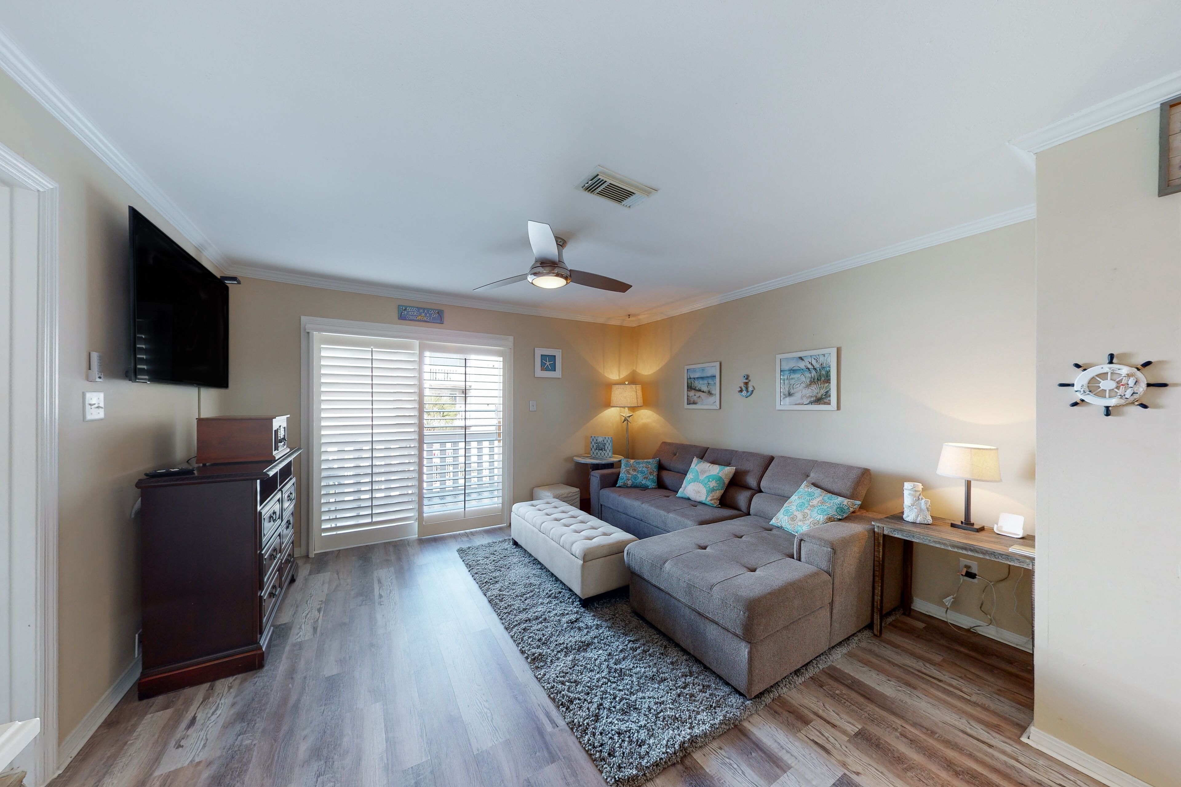 Cozy coastal condo close to beach access with shared pool, WiFi, & central AC