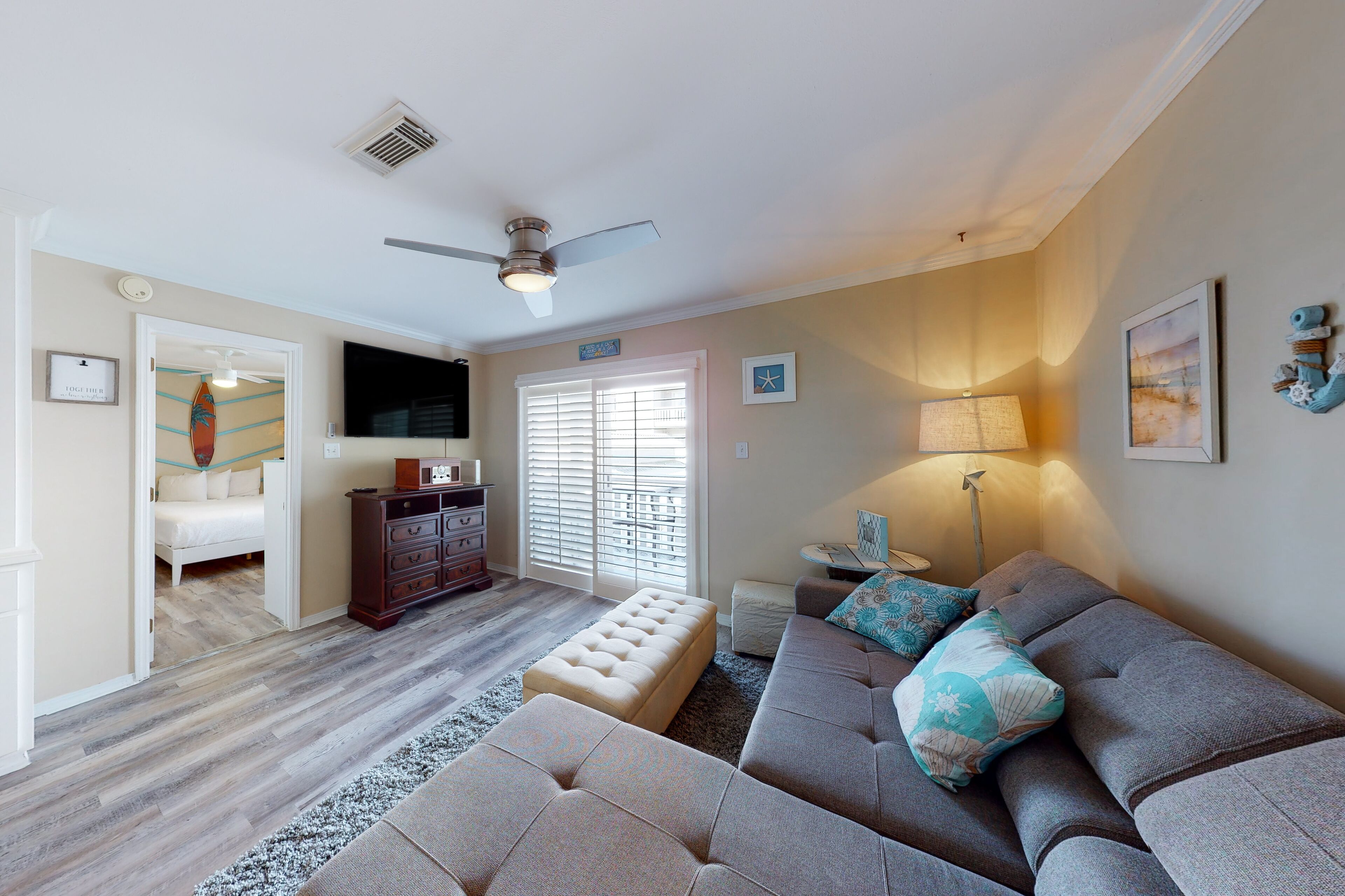 Cozy coastal condo close to beach access with shared pool, WiFi, & central AC