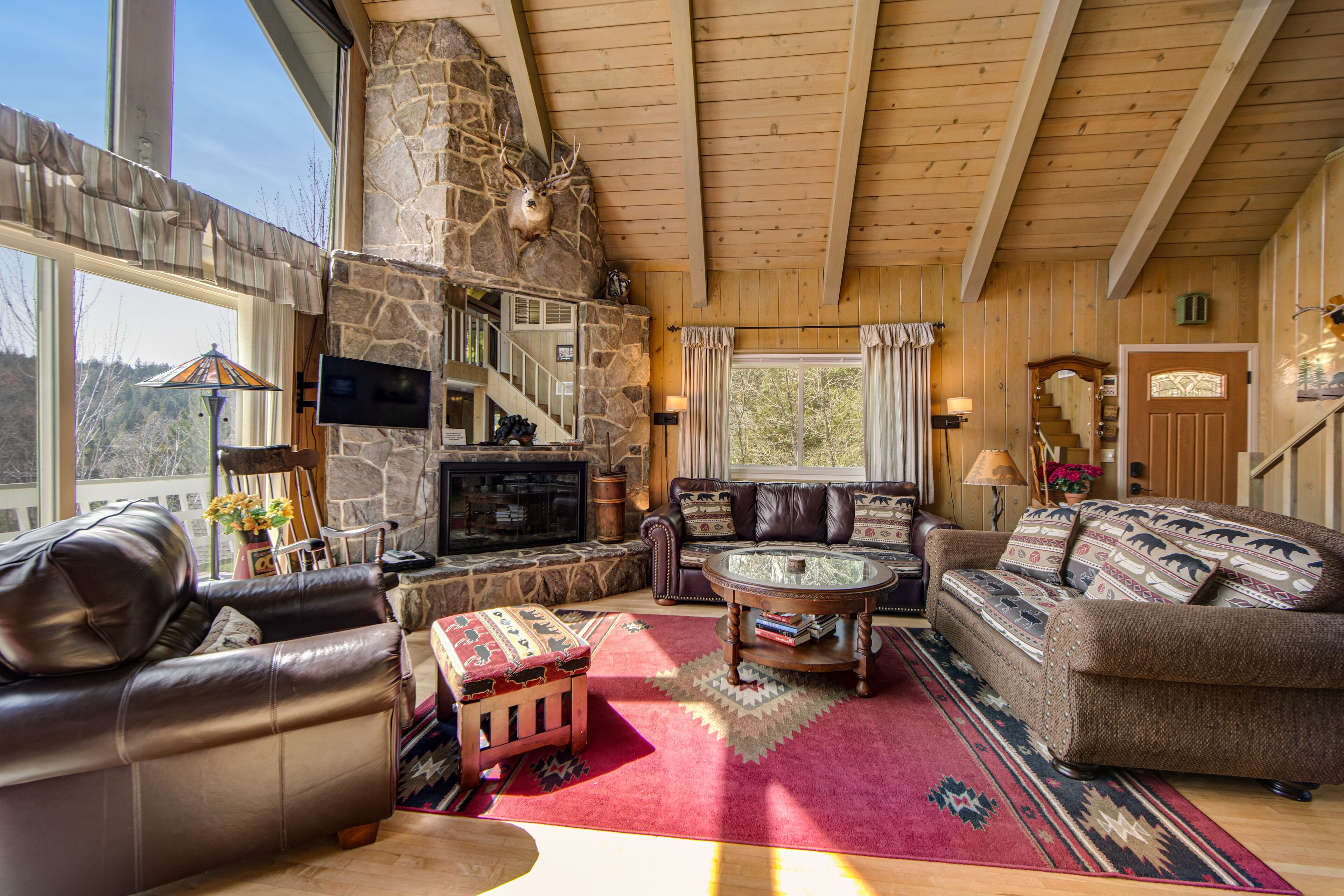 Mountain-view home with fireplace, deck, central AC, game room & washer/dryer