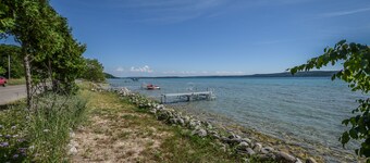 Rustic getaway on Crystal Lake w/ firepit, guest house & private dock