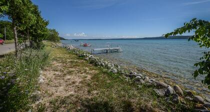 Rustic getaway on Crystal Lake w/ firepit, guest house & private dock