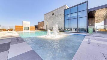 A rooftop pool, sun loungers
