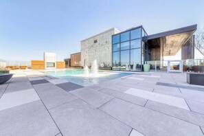 A rooftop pool, pool loungers