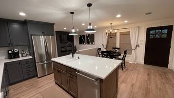 Coffee/tea maker, fridge, microwave, oven