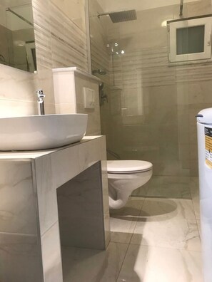 A modern bathroom with a large white sink, a toilet, and a glass-enclosed shower area. - Apartment Villa Jakov - Two Bedroom Apartment with Terrace and Swimming Pool (Rogač)