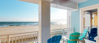 Beachfront condo with 2 oceanfront balconies, W/D, pool, & gym