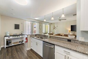 Enjoy cooking in this well-equipped kitchen with a sink, coffee station, and dishwasher.