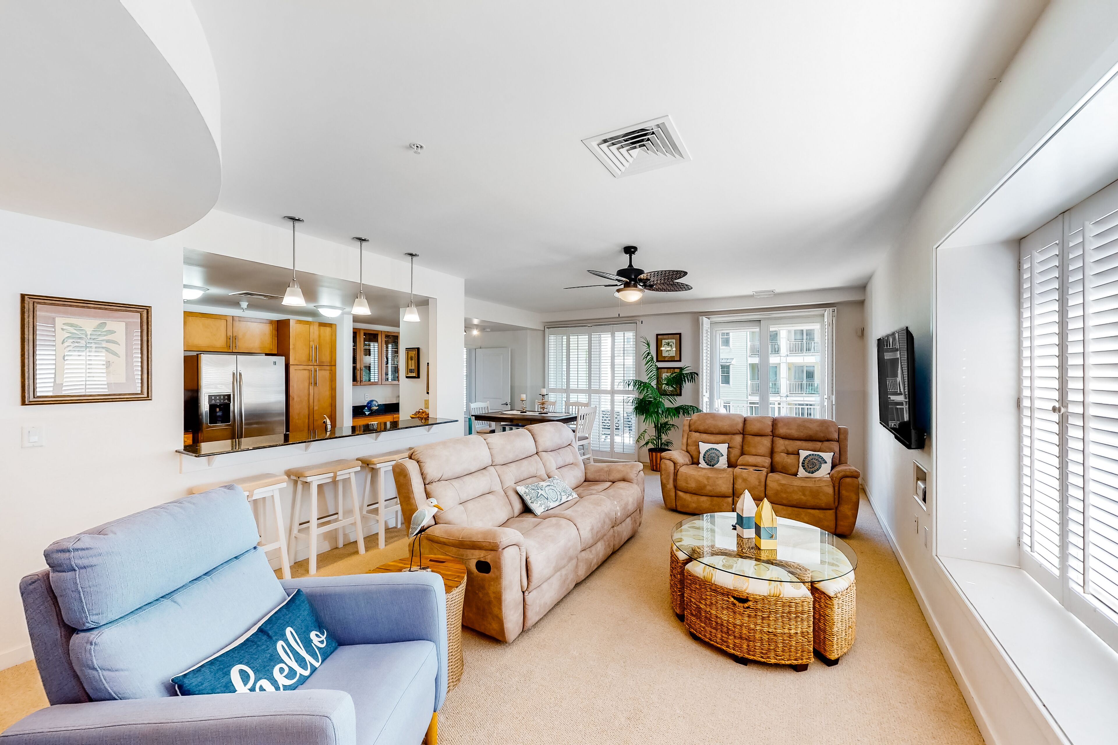 2nd-floor condo with views of the ocean, balcony, on-site outdoor pool, gym & AC