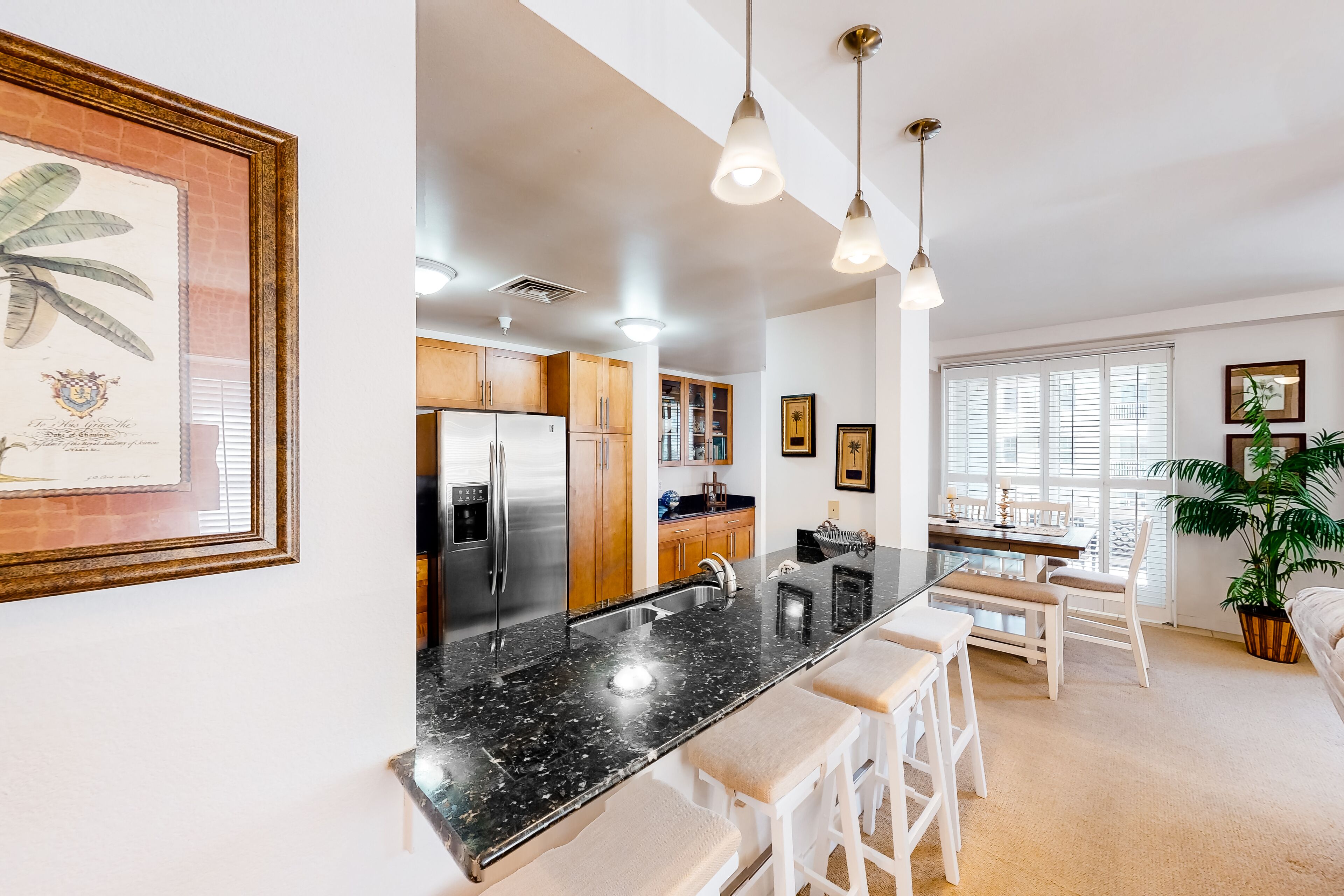 2nd-floor condo with views of the ocean, balcony, on-site outdoor pool, gym & AC