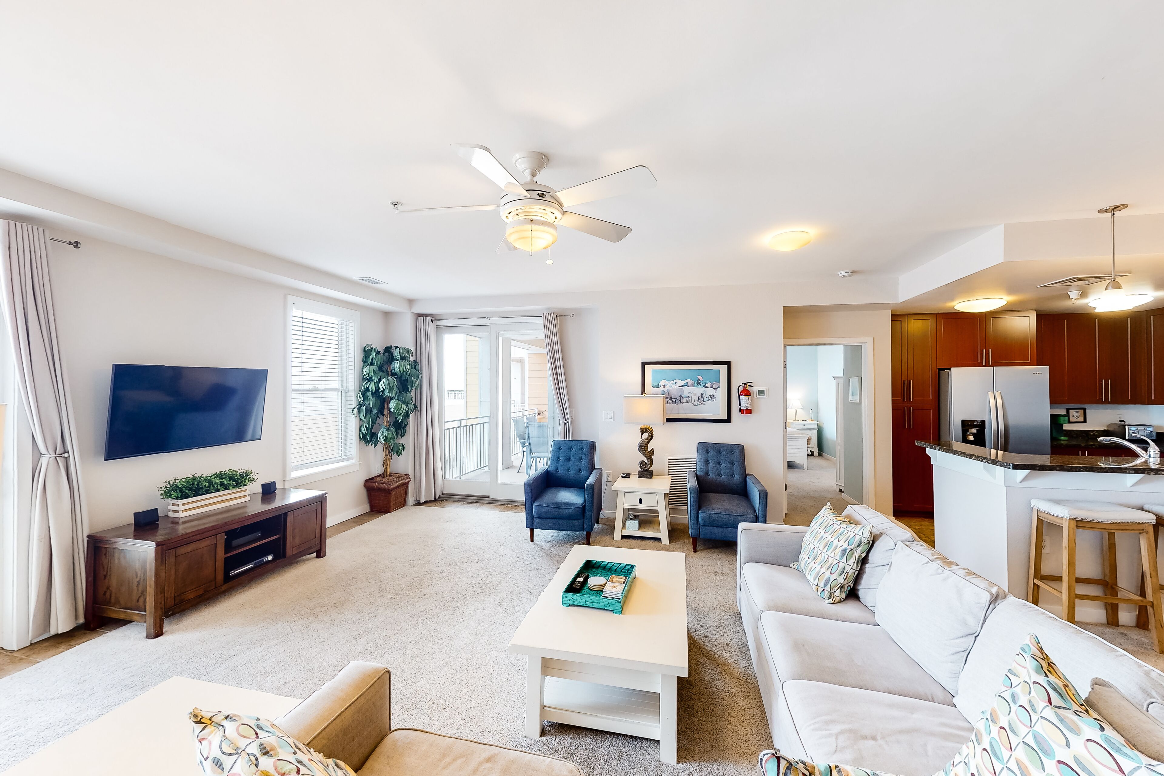 1st-floor oceanfront retreat with private balcony & W/D, beach views & pool