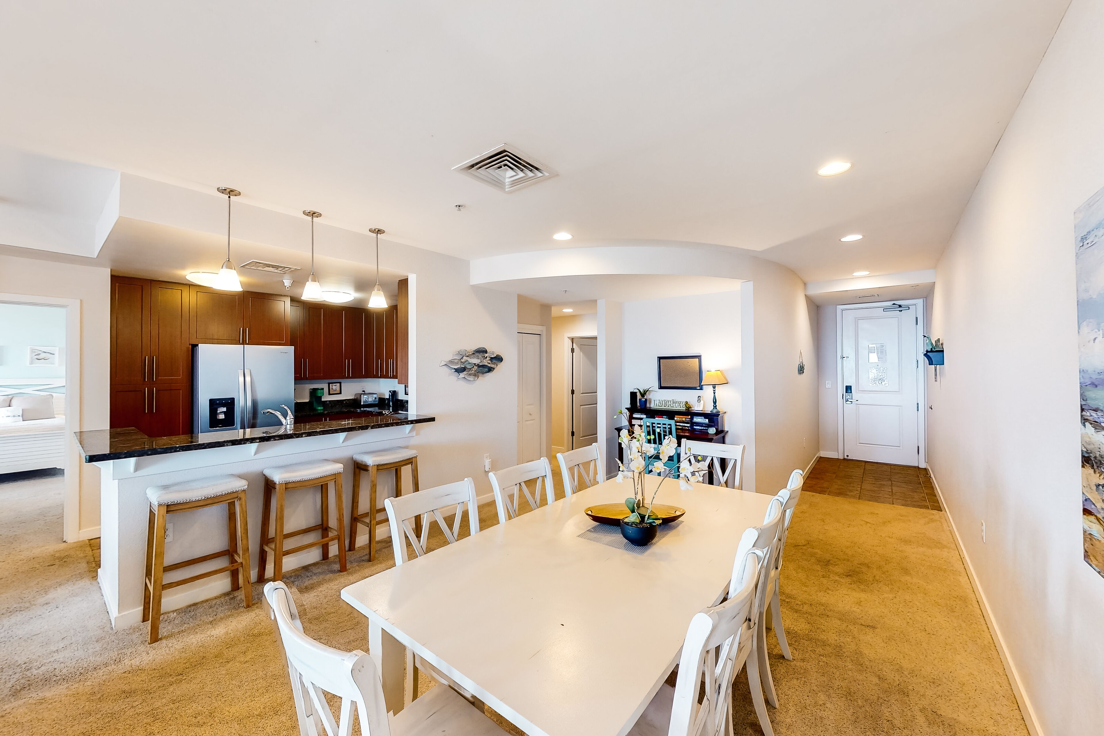 1st-floor oceanfront retreat with private balcony & W/D, beach views & pool