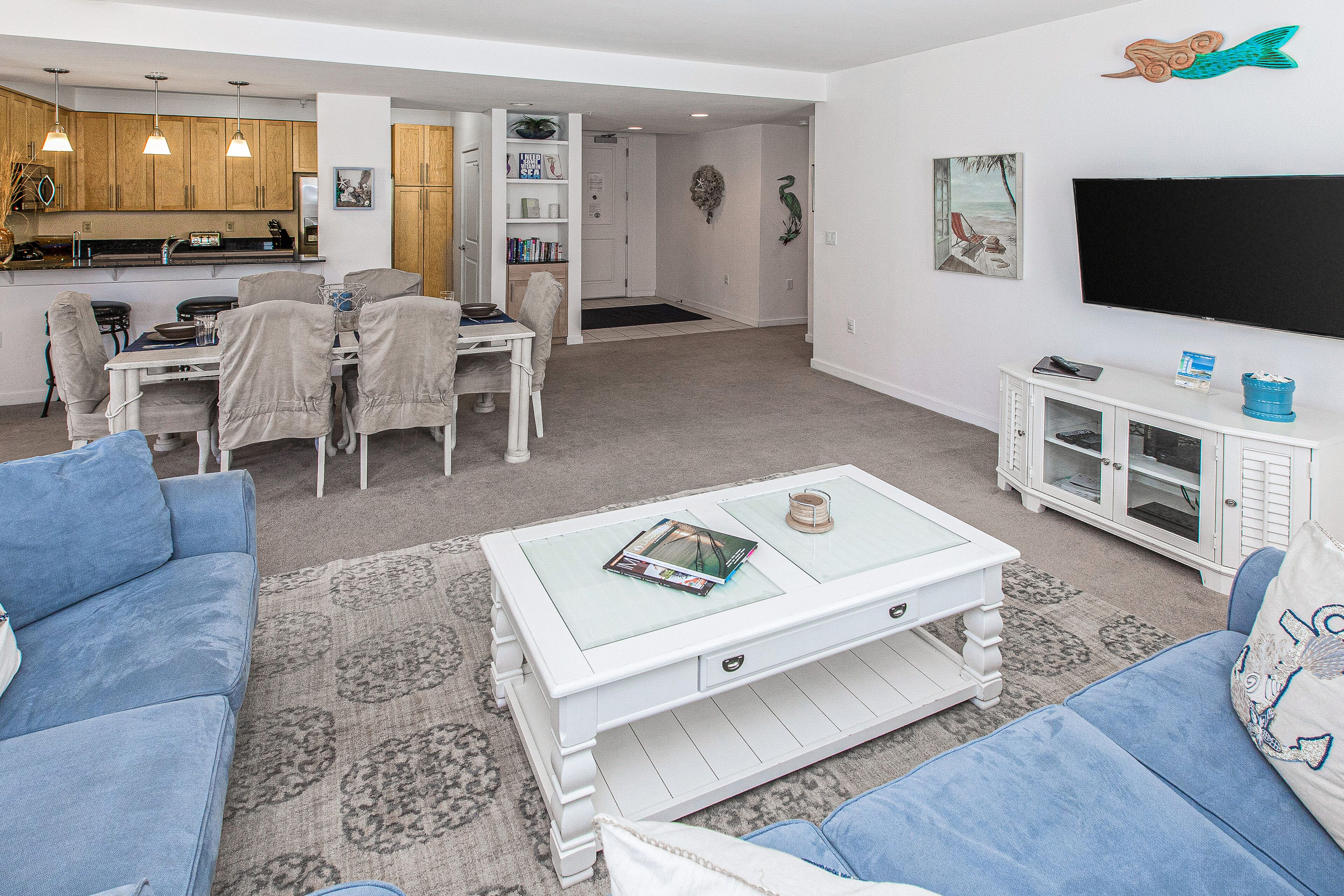 1st-floor condo with private balcony, W/D, outdoor pool, gym & gas grills