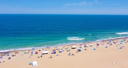 Oceanfront, corner condo with wrap-around deck, great views & on-site pool/gym