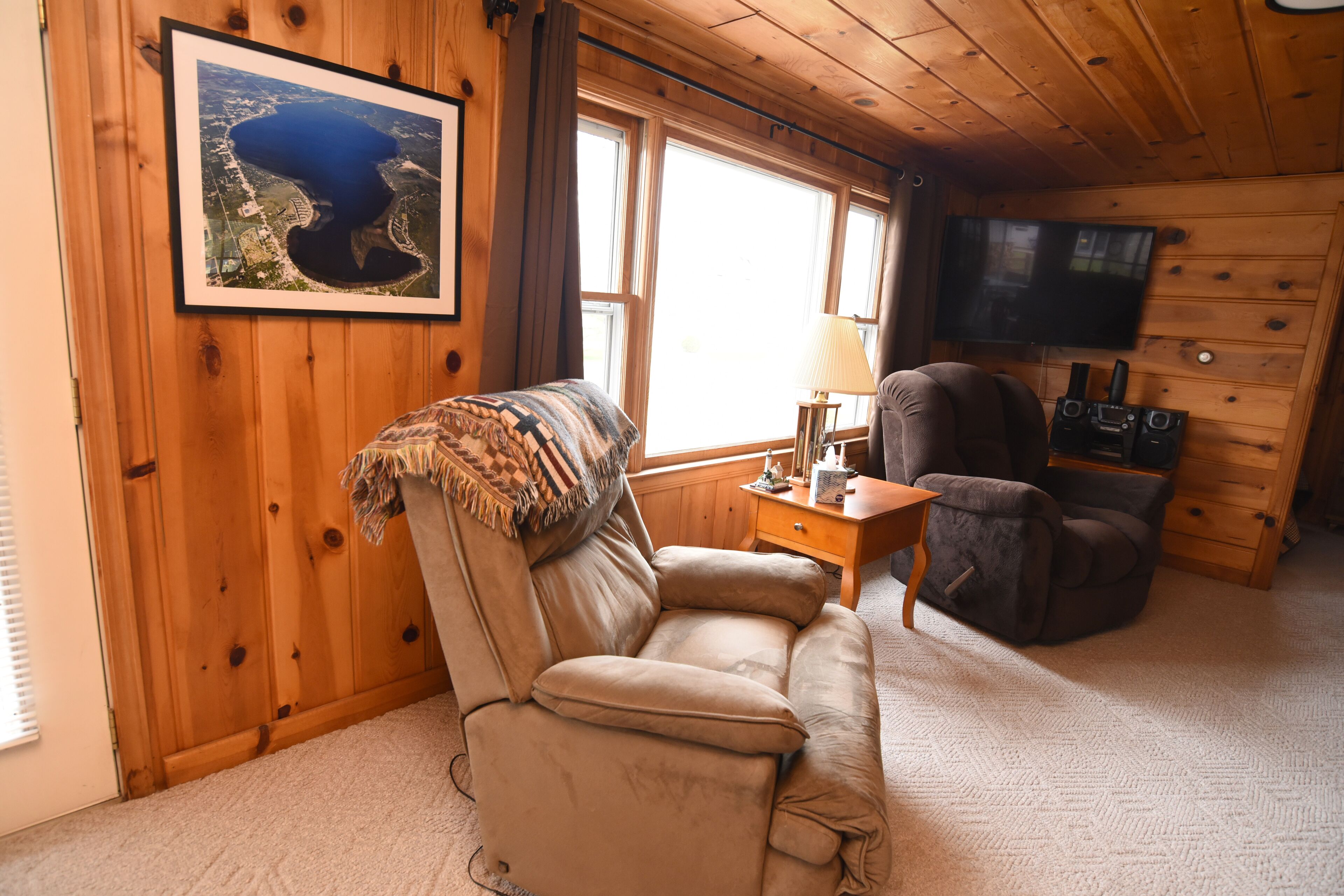 Centrally located, four season retreat w/firepit and lakeview.