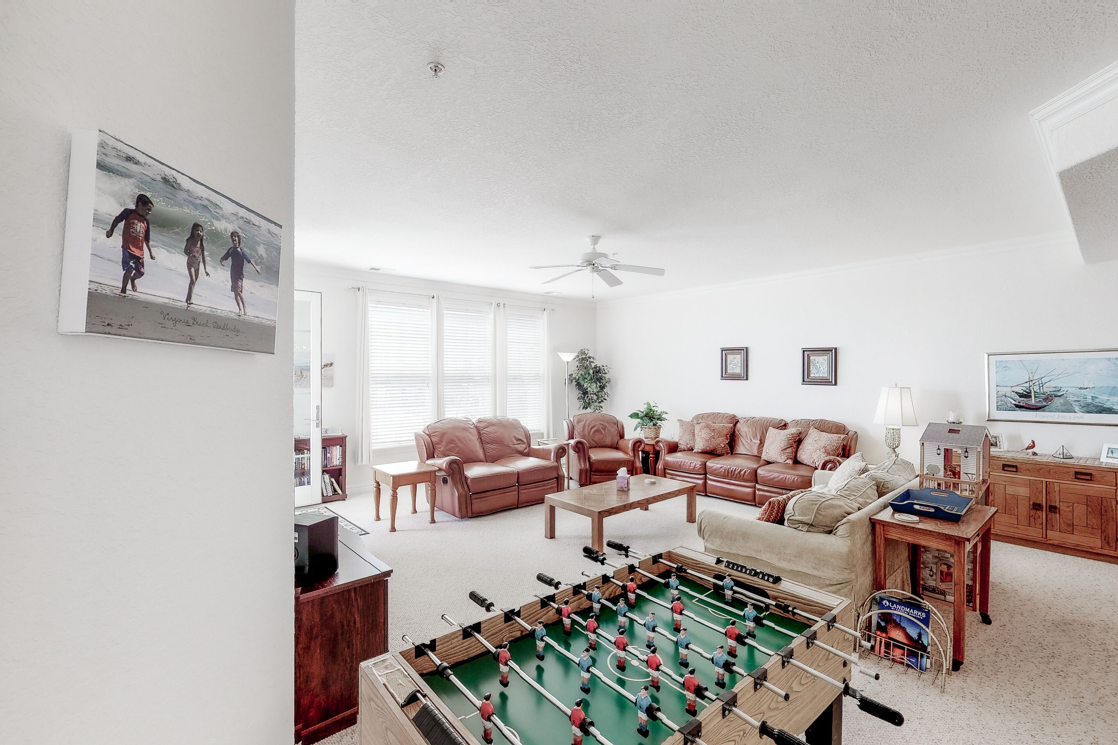 Second-floor, ocean view condo with balcony, foosball, WiFi & on-site pool/gym