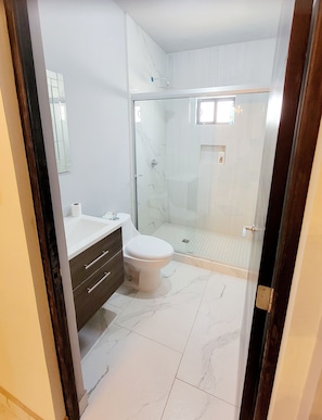 Shower, towels, soap, toilet paper