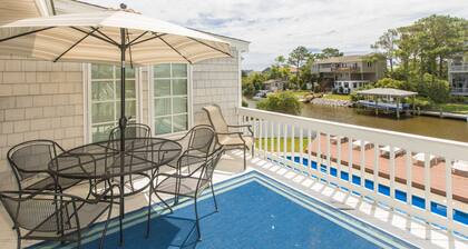 Canal-front home with private pool, fishing dock - walk to the beach, 2 dogs OK