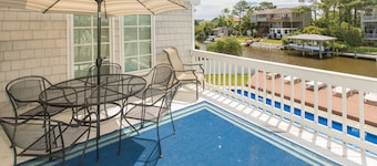 Canal-front home with private pool, fishing dock - walk to the beach, 2 dogs OK