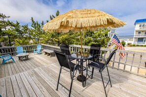 Outdoor dining - Bright and comfortable home steps from beach w/private pool, WiFi, & central AC (Virginia Beach)