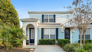 A two-story house with a front entrance, a mailbox, and a mailbox slot. - StarWars Theme + Free Waterpark | 10 min to Disney (Kissimmee)