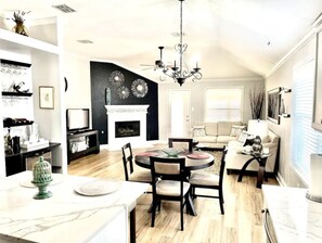 Smart TV, fireplace, books, stereo