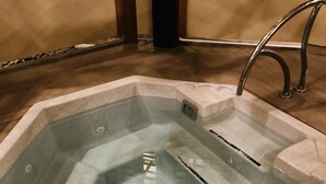 A hot tub with a rectangular shape, a built-in seat, and a faucet. - Cozy Freshly remodeled 1B/1B Retreat close to Main (Park City)