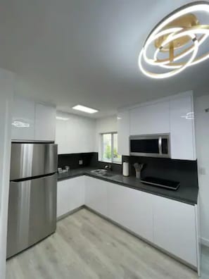 Fridge, microwave, stovetop, coffee/tea maker