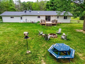 A house with a deck, a fire pit, and outdoor seating. - The Reserve at Plum Bottom in Egg Harbor! (Egg Harbor)