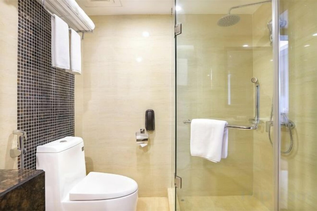 Designer toiletries, hair dryer (on request), slippers, towels