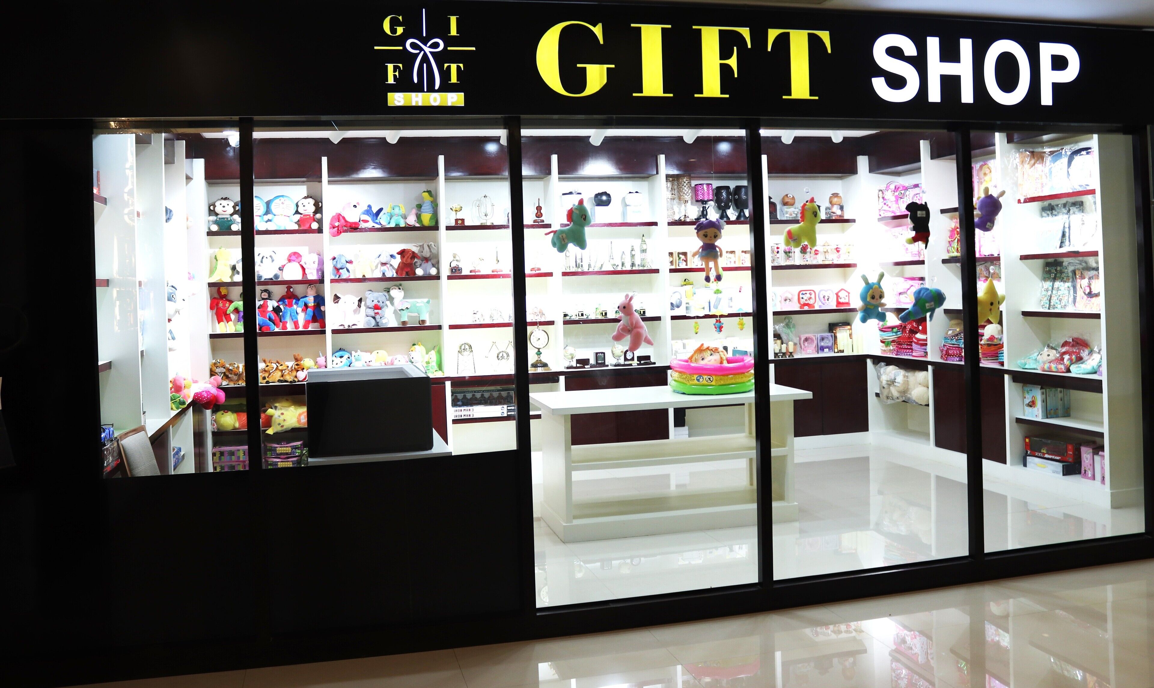 A gift shop with shelves of toys and knick-knacks.