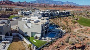 A modern residential complex with multiple buildings, a swimming pool, and a well-maintained lawn. - Birdie On The 8th | Private Pool/Hot Tub (Washington)