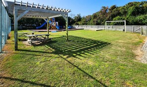 Children's area - Our Legacy - Dog Friendly Oceanside 4 BR Cottage with Community Pool access (Duck)