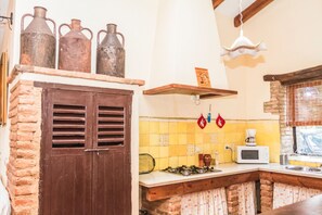Fridge, oven, coffee/tea maker, cookware/dishes/utensils