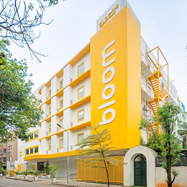 A modern building with a yellow facade and multiple windows. - Bloom Hotel - Brookefield (Bengaluru)
