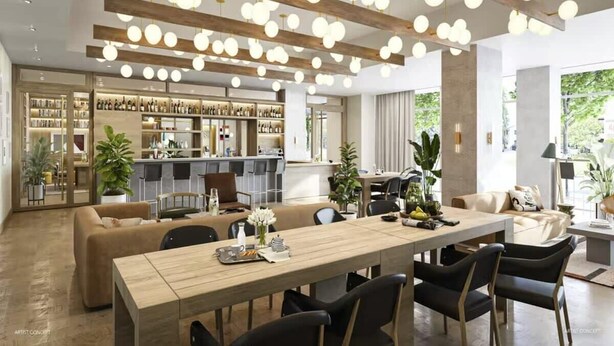 A modern dining area with a wooden table, black chairs, and hanging spherical lights. - Luxe Rainey St High Rise / Heated Pool / Gym / ATX (Austin)