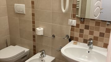 Shower, bidet, towels, soap