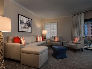 Relax in comfort with a large sofa set, armchairs, and a small table.