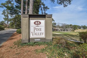 A sign for Pine Valley, marked as private property, with a golf course in the background. - To The Green On #17 - Boutique Studio w/ GREAT Views, 5 Minutes From Clubhouse (Pinehurst)